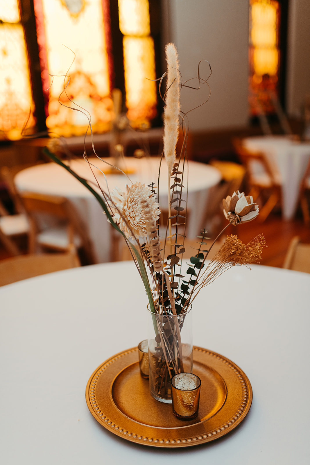 floral decoration at Mansion Hill Sanctuary's event space in Newport with elegant stained glass windows
