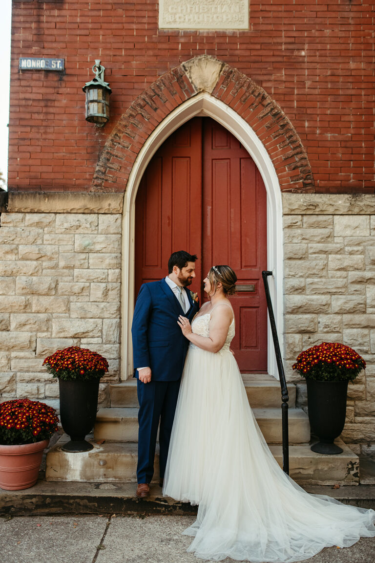 couple standing on Monroe Street in Newport KY at the Mansion Hill Sanctuary wedding venue