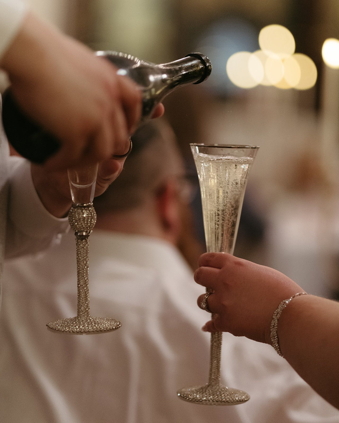 guests pouring champagne at the Mansion Hill Sanctuary event center